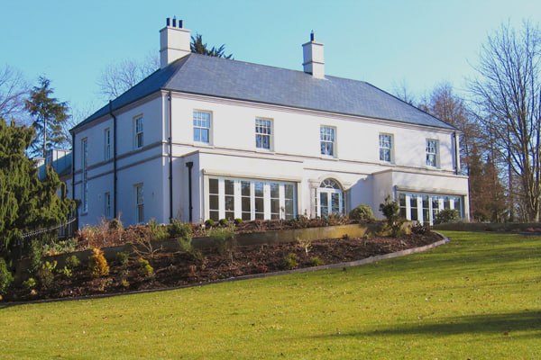 M E Crowe-built Georgian-style country house with portico, County Antrim